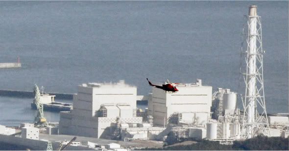A helicopter flying past Japan's Fukushima Daiichi No.1 Nuclear reactor on 12 March 2011.